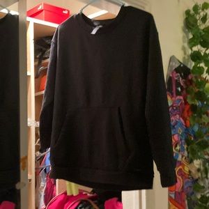 This is a black sweater with pockets and no hoodie